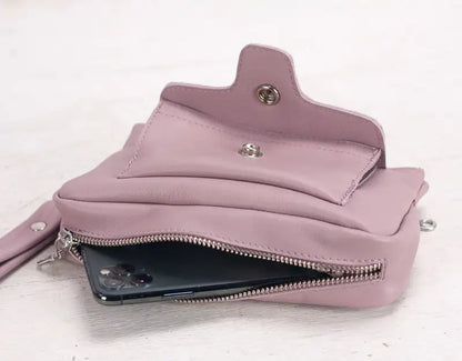 Pink wallet with a zipper on a white background