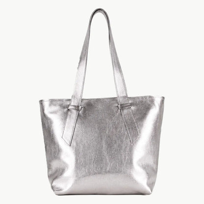 A metallic silver tote bag with two shoulder straps, shown against a plain off-white background.
