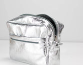 Silver bag insert on a light gray background