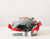 Fabric pouch with red zipper on a white background