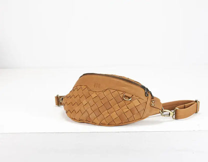 Brown woven waist bag on a white background