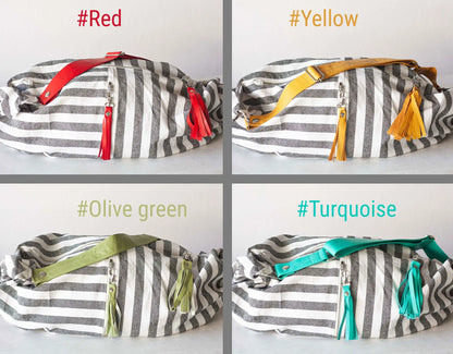 Four striped bags with colorful straps on a white background