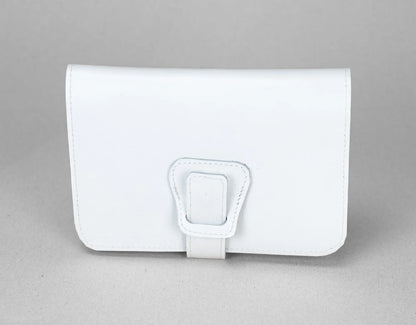 White leather wallet with a buckle on a gray background