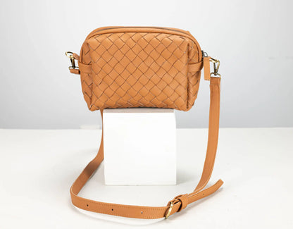 a brown leather woven bag 