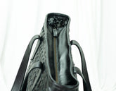 Black leather handbag with floral interior