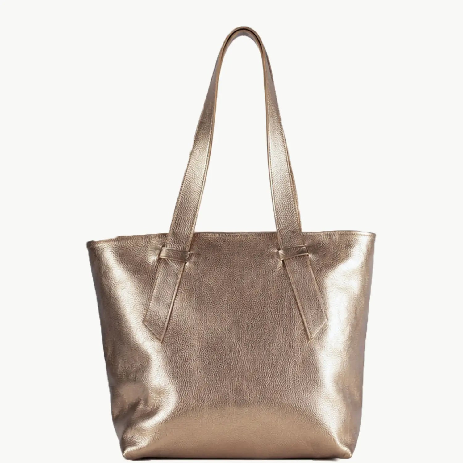 A metallic rose gold leather tote bag with two shoulder straps, shown against a plain off-white background.
