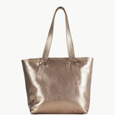 A metallic rose gold leather tote bag with two shoulder straps, shown against a plain off-white background.