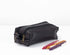Black leather pencil case with a zipper compartment containing several pens, placed on a white background.